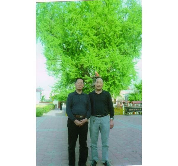 原郯城縣人大主任楊玉金與國樹酒懂事長合影